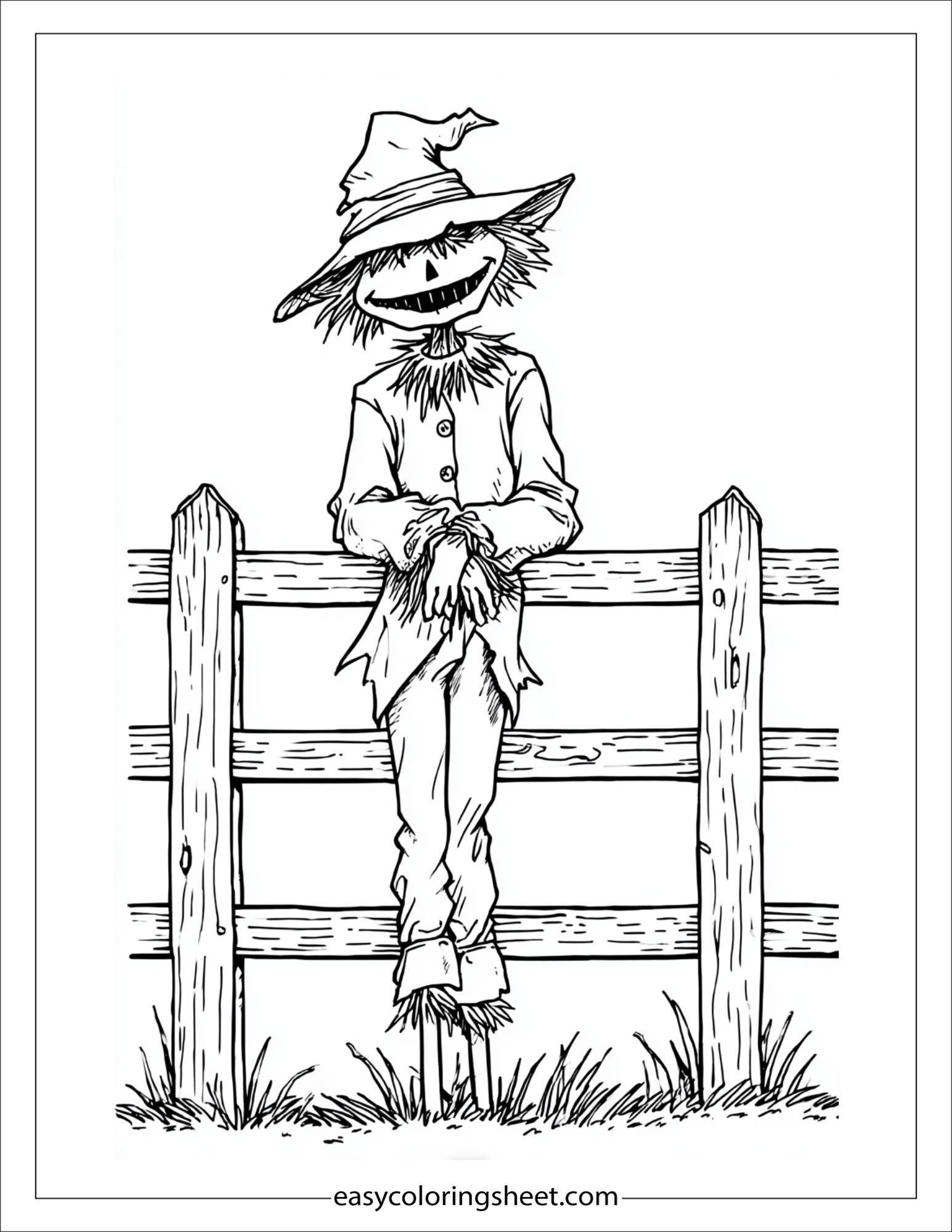 Scarecrow leaning on a fence